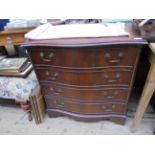 Reproduction mahogany small serpentine fronted chest of 4 drawers each with brass drop handles