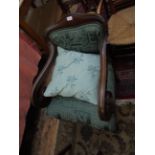 Victorian mahogany framed armchair on reeded feet on brass castors,