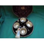 Boxed set of 4 matching circular silver salts with spoons(London 1889)