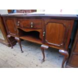 Mahogany early 20th century bow fronted sideboard the central drawer and wing cupboards fitted