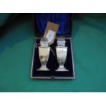 Boxed pair of silver cruets (Chester 1900)