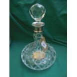 Silver mounted (Birmingham 1983) cut glass ships decanter with golf ball stopper and silver brandy