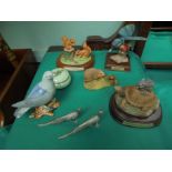 Box containing ornamental animals, some on wooden stands being squirrel, mouse, hedgehog,