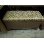 Well presented Lloyd Loom style ottoman with top lid of fabric design