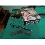 Tin containing a variety of cigarette and tea cards, cut throat razor in original case,