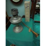 Old metal oil lamp base with Aladdin lamp chimney in original box and decorative copper horn