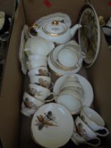A tea service marked Duchess bone china with pheasant scene to include cups, saucers, teapot,
