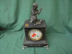 Slate mantel clock with decorative figurines to top,