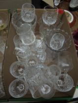 Box containing a number of cut glass wine and tumbler glasses with 3 glass celery containers