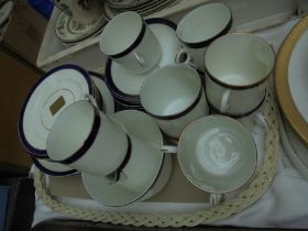 Selection of blue and white coffee cups and plates,