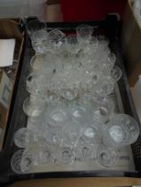 Large crate containing a variety of cut glass wine glasses and others