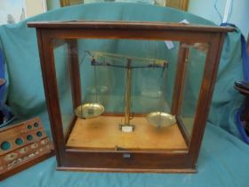 Nice presentation of brass weighing scales in large original case to include weights in wooden box