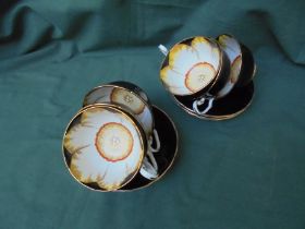 A delicate set of 6 cups and saucers with delightful internal decoration entitled Jon Quill,