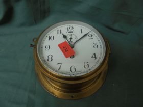 Brass bulk head clock with enamelled face, manufacturer Tempurer,