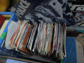 Collection of old 45 RPM records in sleeve,