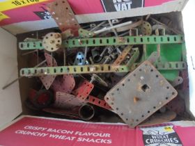 Smaller box of mixed Meccano parts including wheels, motors,