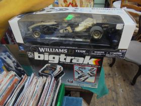 Remote control boxed Williams Formula One racing car together with a much sort after Big Trak
