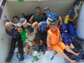Collection of 9 Action Man figures from the year 2000 with various pieces of equipment and