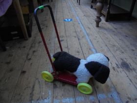 Push-along soft toy dog on wheels(Possible Triang)