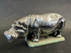 A car accessory mascot in the form of a hippopotamus, display base mounted, approx. 4 1/2" long.