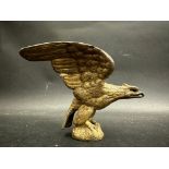 A car accessory mascot in the form of a bird of prey, approx. 3 3/4" high.