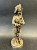A car accessory mascot in the form of a Highland soldier, approx. 6" high.