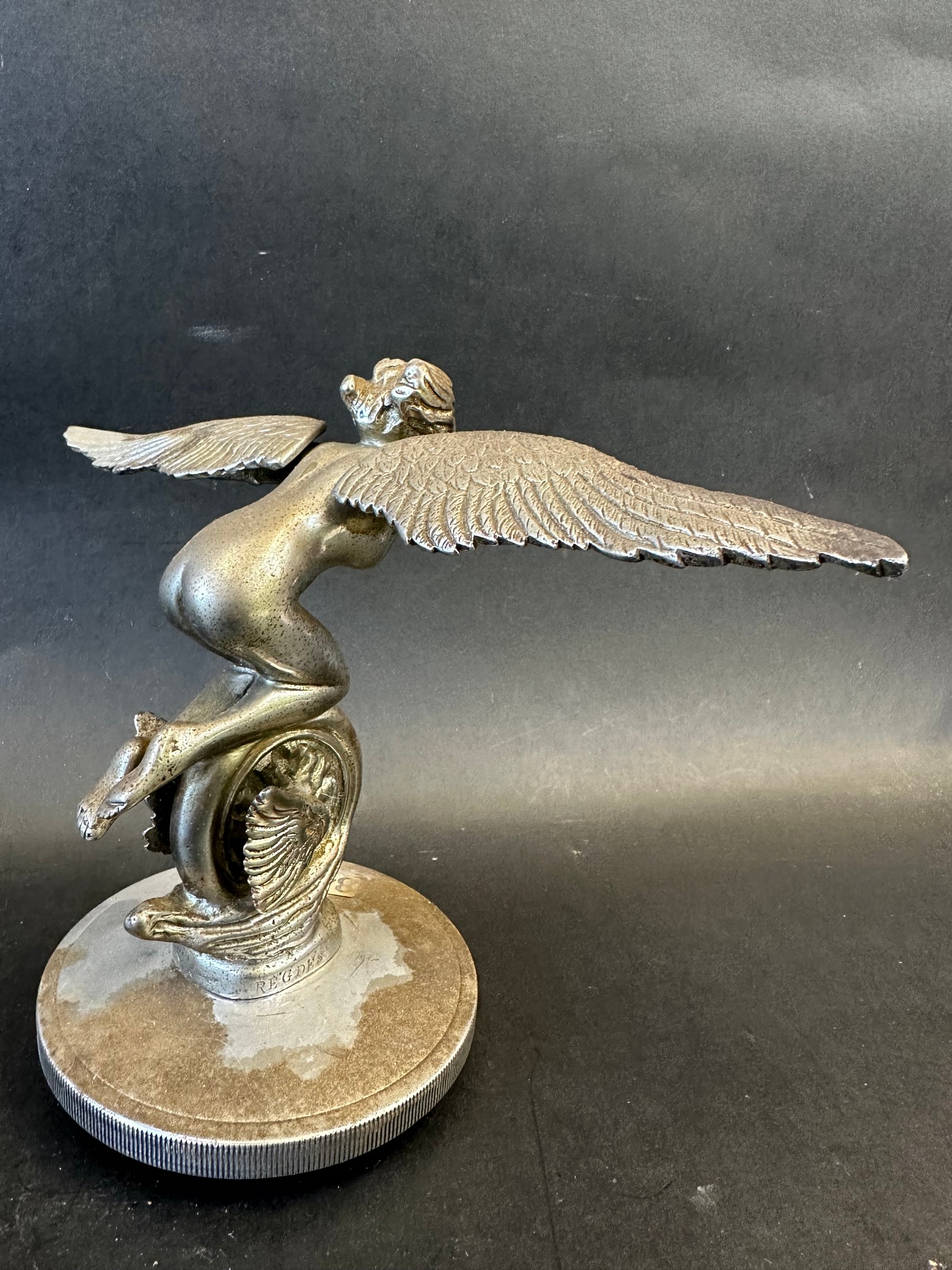 An unusual car mascot in the form of a winged speed nymph or Lady Icarus knelt on a winged wheel, - Image 4 of 5