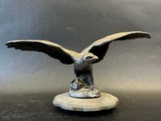 A car mascot in the form of a bird of prey with outstretched wings, stamped RD AEL (Lejeune)