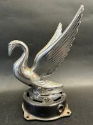 A car accessory mascot in the form of a swan, display base mounted, approx. 9" high overall.