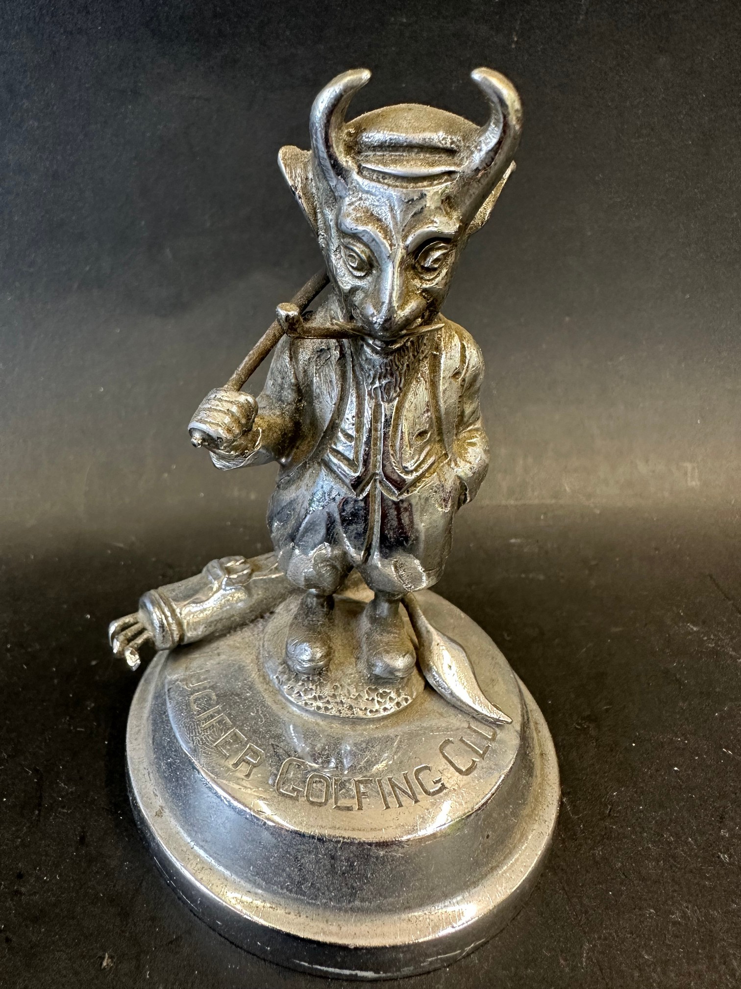 A Lucifer Golfing Club mascot/trophy depicting the society's emblem Lucifer/The Devil playing golf