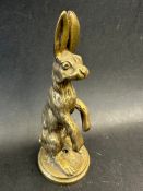 An Alvis 12/50 car mascot in the form of a standing hare, approx. 4 1/2" high.