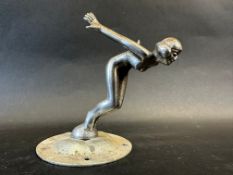 A car mascot in the form of a diving nude female, display base mounted, approx. 4 1/2" tall overall.