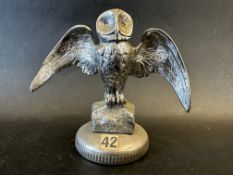 A car mascot in the form of an owl with outstretched wings, stamped AEL to left side and R DAEL to