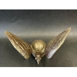 A car accessory mascot in the form of a stylised bird of prey, display base mounted, approx. 3 3/