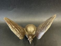 A car accessory mascot in the form of a stylised bird of prey, display base mounted, approx. 3 3/