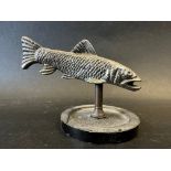 A car mascot in the form of a fish, display base mounted, approx. 4 1/2" wide.