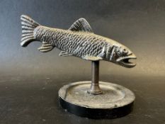 A car mascot in the form of a fish, display base mounted, approx. 4 1/2" wide.