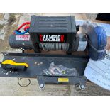 A Champion Power Equipment winch plus instructions and towing strop, by repute little or not used.