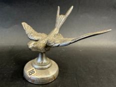 A Swift Cars car mascot mounted on a radiator cap, approx. 4 1/2" high overall.