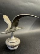 A car accessory mascot in the form of a bird in flight, mounted on a radiator cap, approx. 6" high.