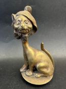 A 'Grinning Cat' mascot depicting a cat dressed in a bonnet, reg. no. to verso, approx. 5 3/4" high.