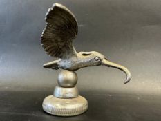 A car accessory mascot in the form of a long beaked bird, mounted on a radiator cap, approx. 3 3/