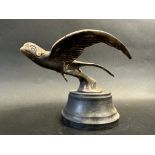 A car accessory mascot in the form of a swallow in flight, display base mounted, approx. 4 1/2" high