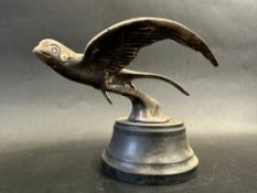 A car accessory mascot in the form of a swallow in flight, display base mounted, approx. 4 1/2" high