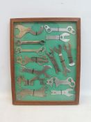 A framed and glazed dioramah display of bicycle tools.