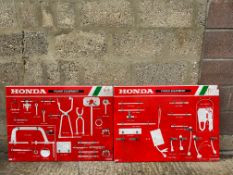 Two Honda workshop tool/part display racks.