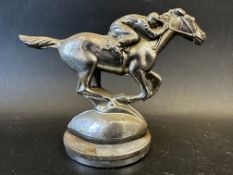 A car accessory macot in the form of a horse and jockey, radiator cap mounted, approx. 5" high