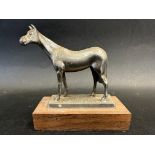 A car accessory mascot in the form of horse, display base mounted, approx. 4 3/4" high.