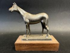 A car accessory mascot in the form of horse, display base mounted, approx. 4 3/4" high.