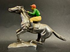 A car accessory mascot in the form of a horse and jockey, painted jockey, marked to base: LL Mascots
